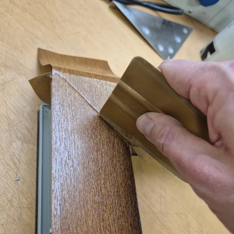 The film is fitted to a rounded corner of the window frame