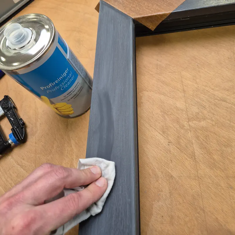 The window frame is cleaned before wrapping